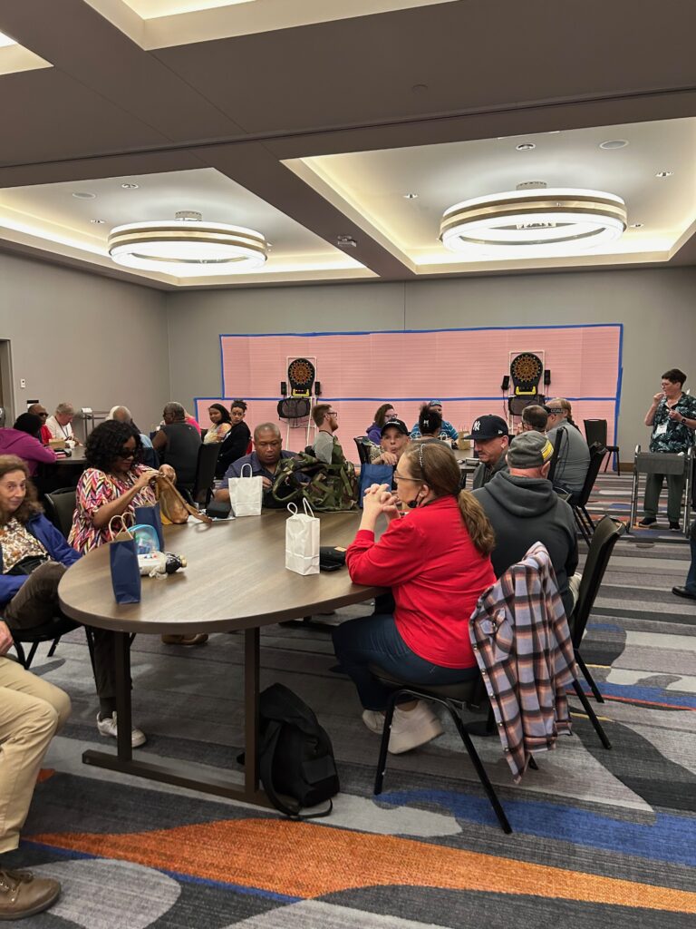 crowd of players at tables